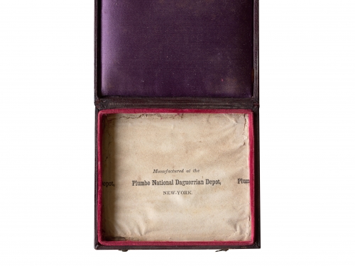 Box with a leather bound case inside.