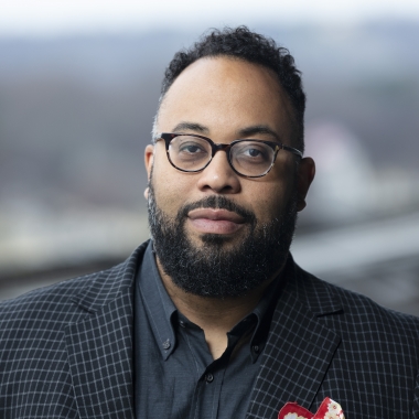 Kevin Young looks directly ahead 